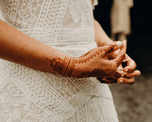 A woman's hands with henna on them