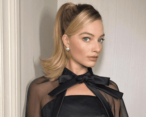 Margot Robbie wearing a Barbie ponytail