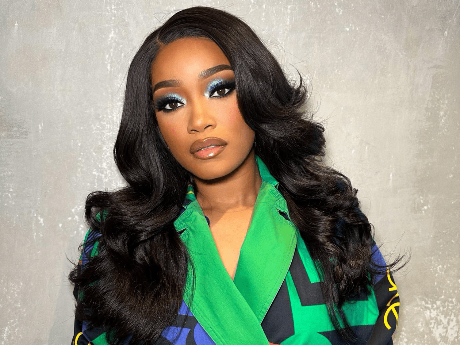 Keke Palmer wearing blue eyeshadow and voluminous hair