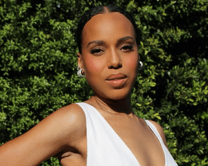 Kerry Washington wearing a bun and white dress.