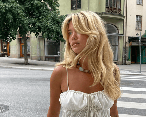 woman with blonde, layered haircut