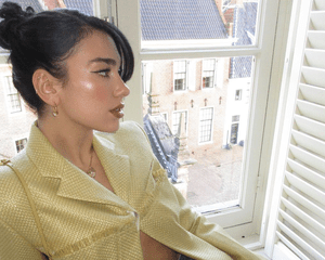 Dua Lipa wearing bright highlighter