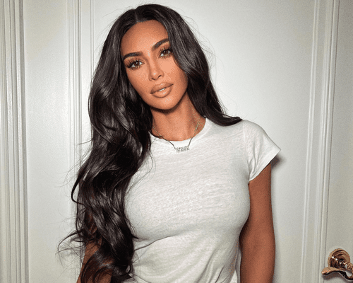 kim kardashian with loose waves in white t shirt