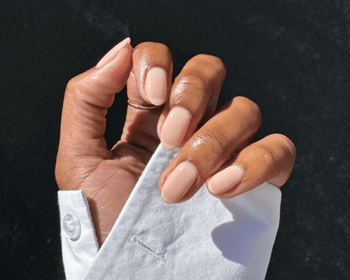 Close up of a hand with nude nails