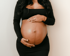 Image of a pregnant woman holding her belly