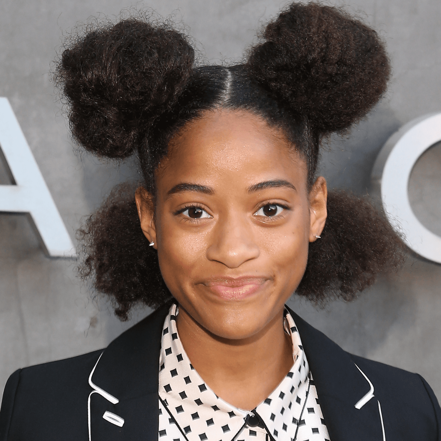 model wearing double afro puffs