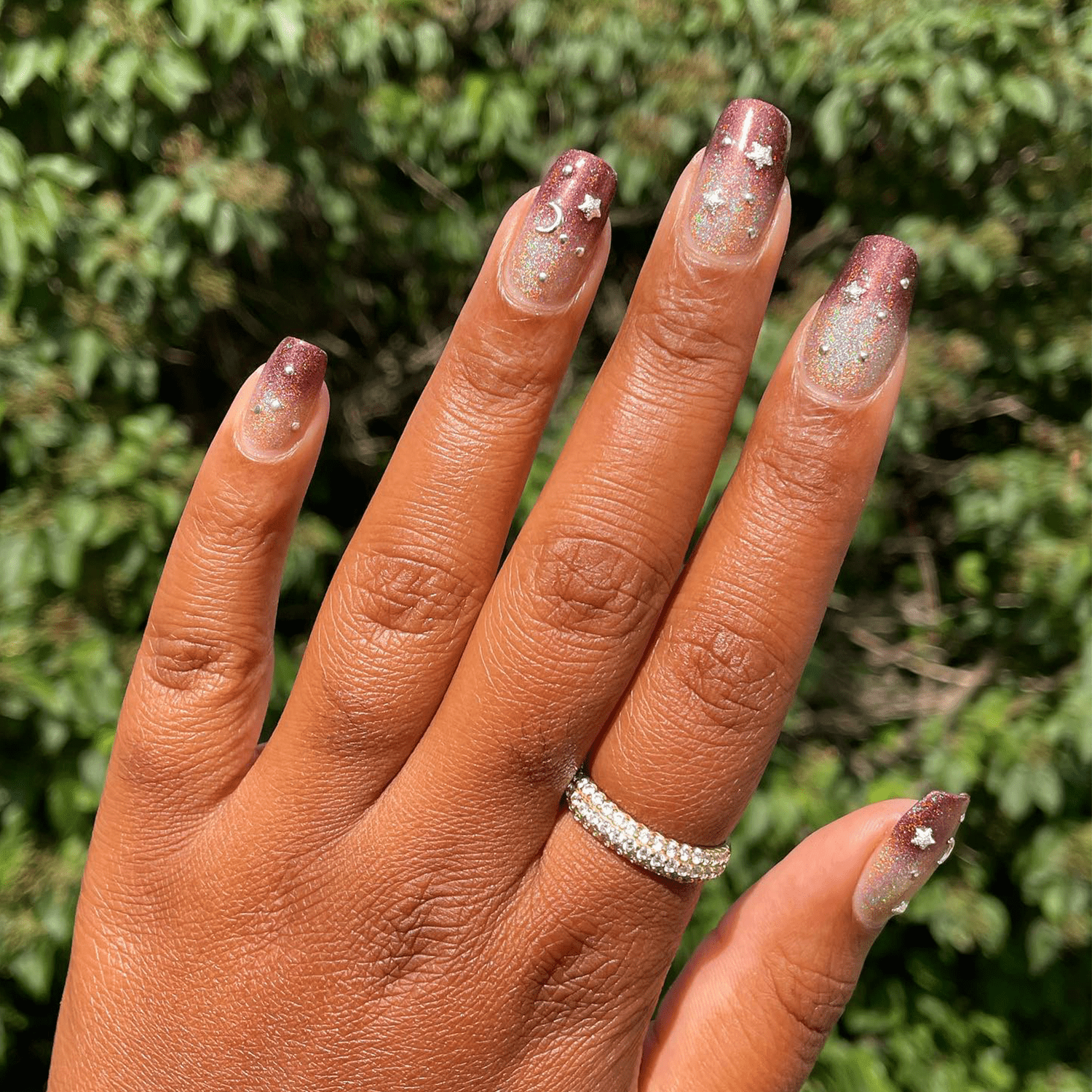 Dark rose gold to gold ombre nails with silver decals 