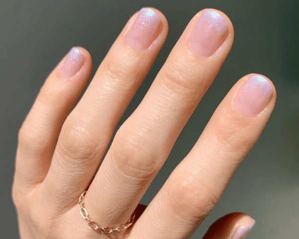 close up of pink ombre sparkle nails