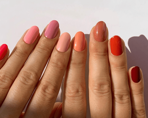 colorful acryllic nails on white background