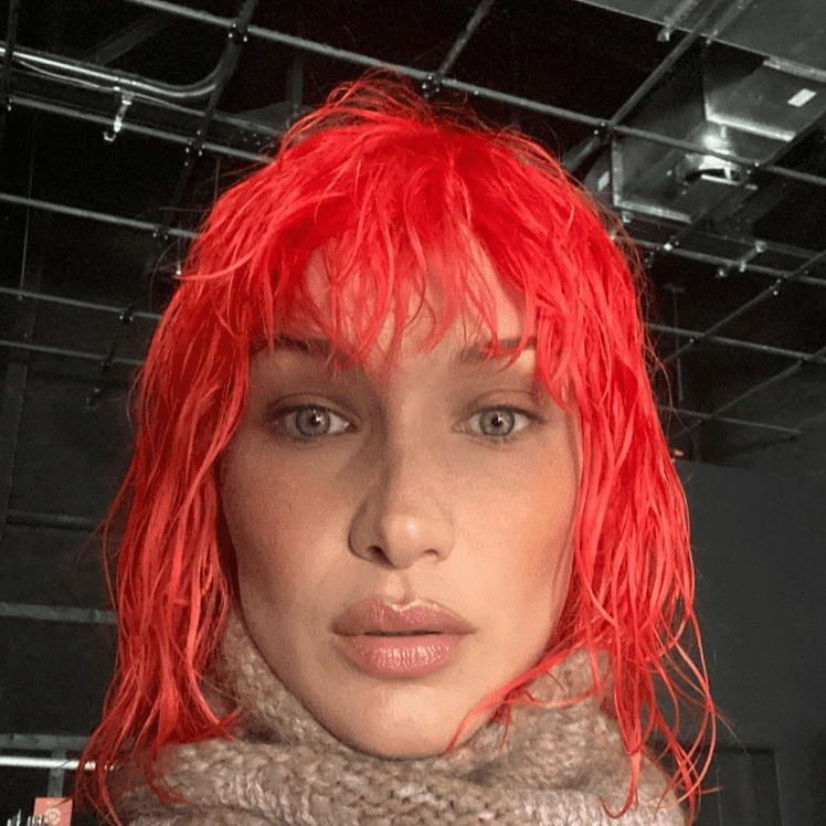 Bella Hadid in a short red wig