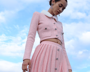 Model wearing a pink holiday outfit