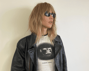 suki waterhouse in leather jacket and sunglasses