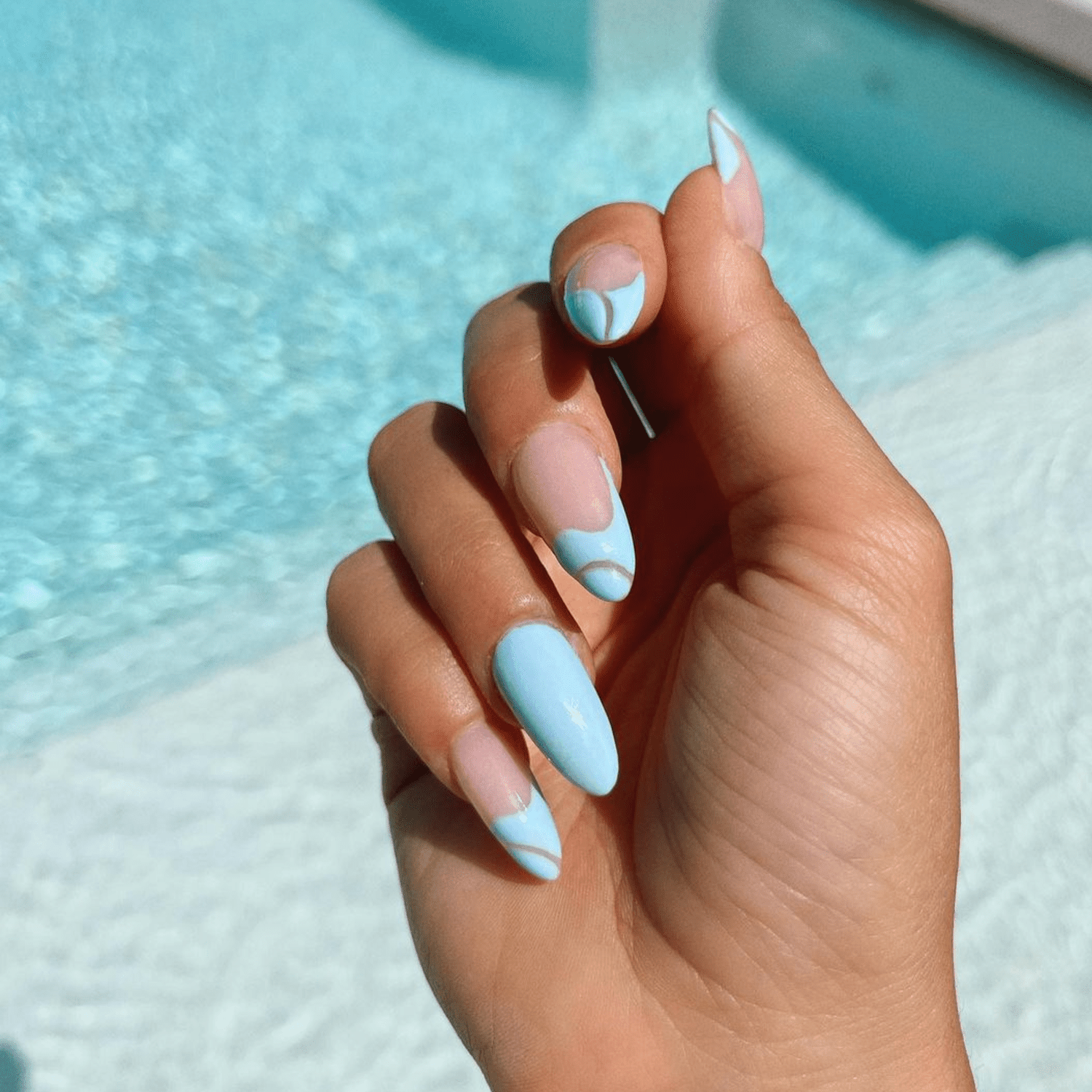 Long pool blue nails with design