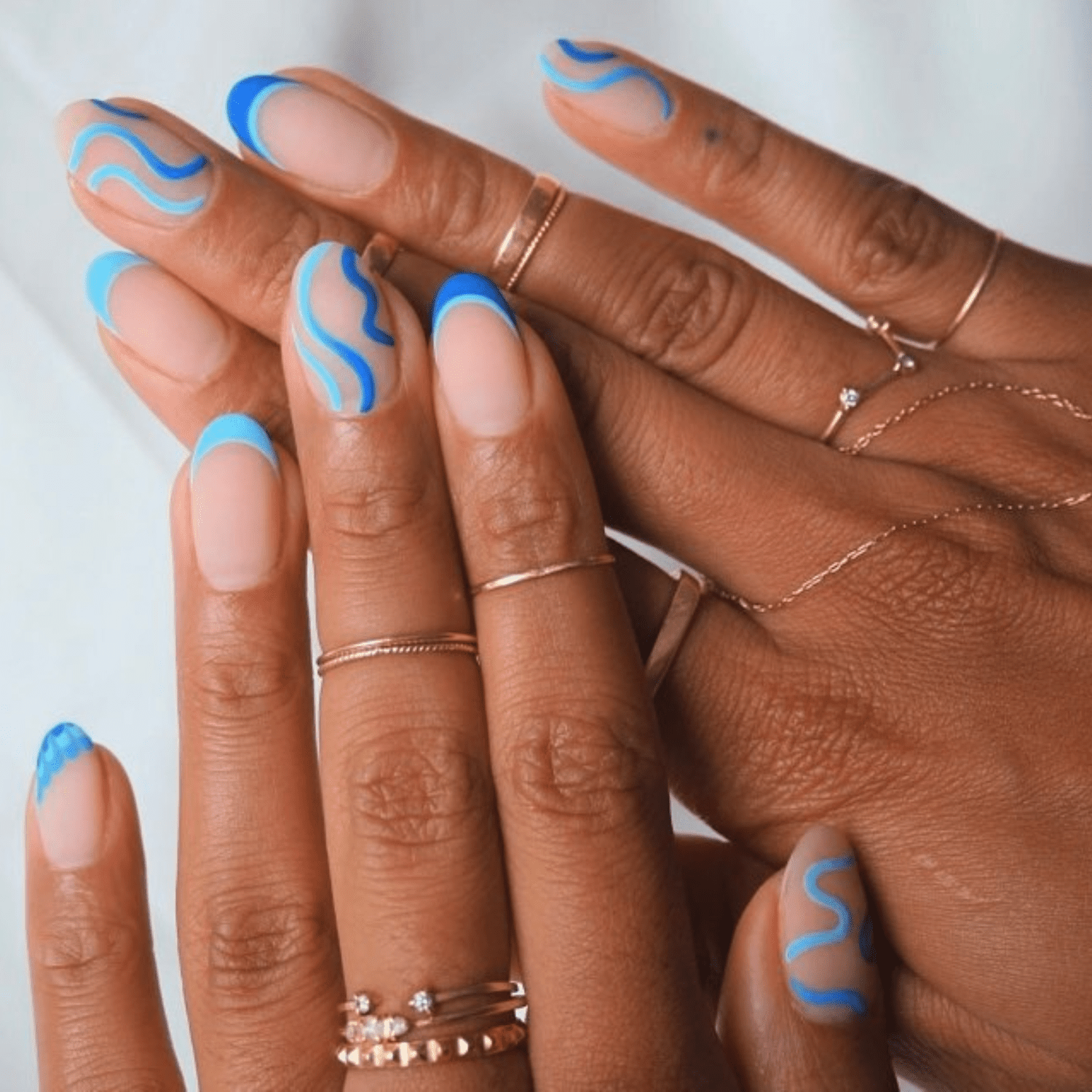 Blue squiggle French manicure