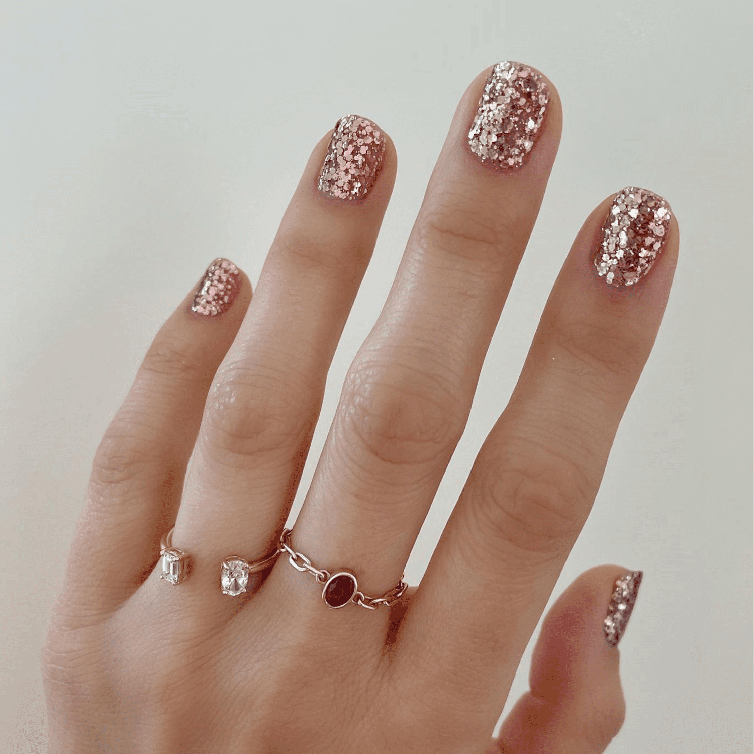 Yellow gold to rose gold glitter ombre nails.